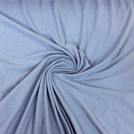Light blue premium natural fabric by Nature's Fabrics, draped in a spiral pattern.