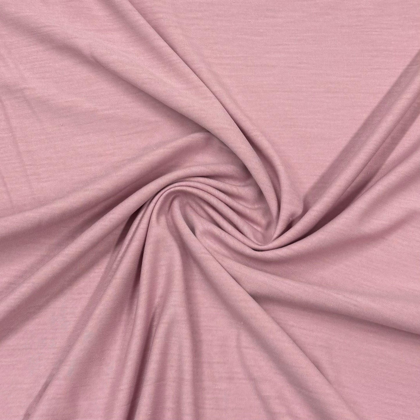 Soft pink organic cotton fabric by Nature's Fabrics, ideal for eco-friendly sewing projects and apparel.