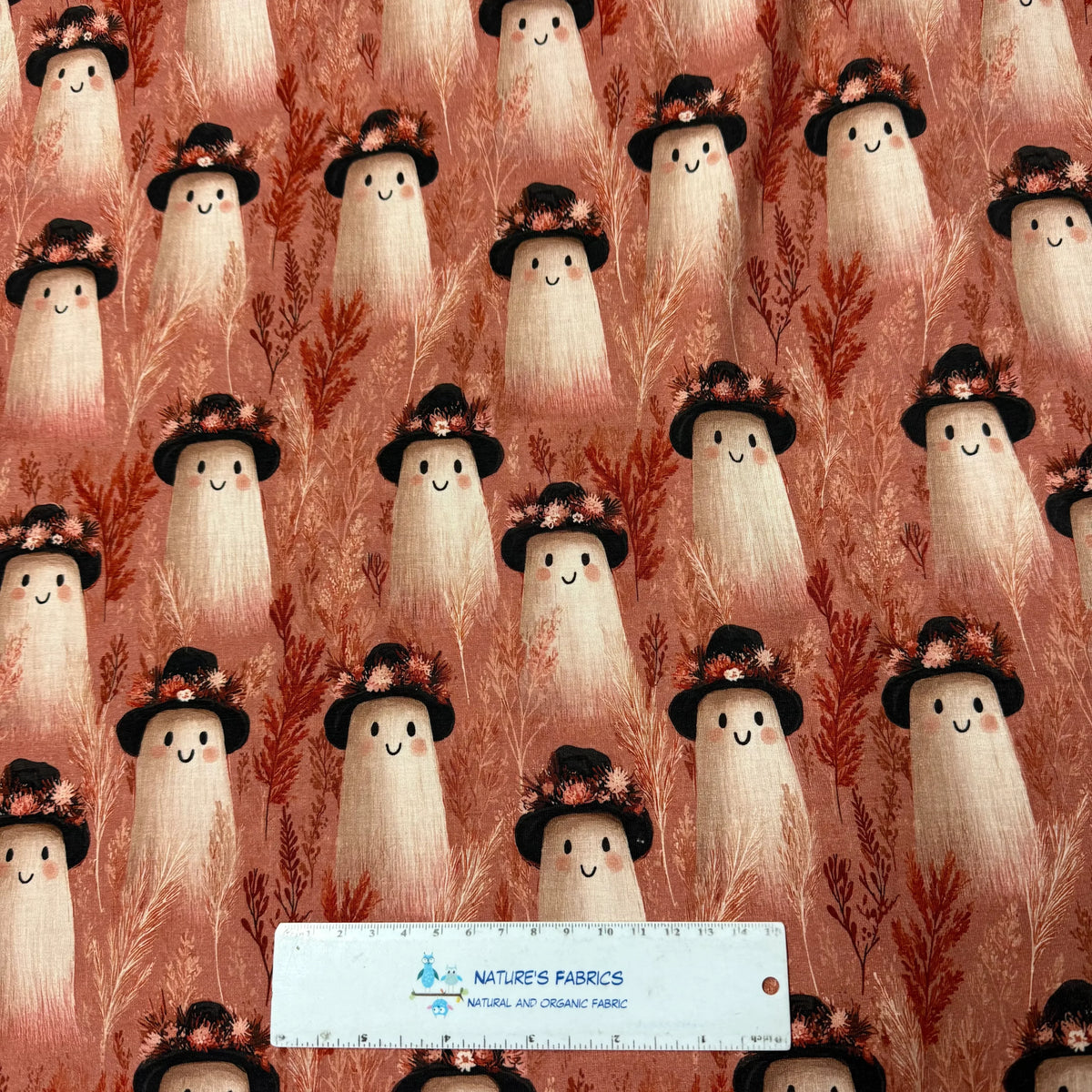 Cute ghost pattern fabric with floral hats by Nature's Fabrics, organic cotton material