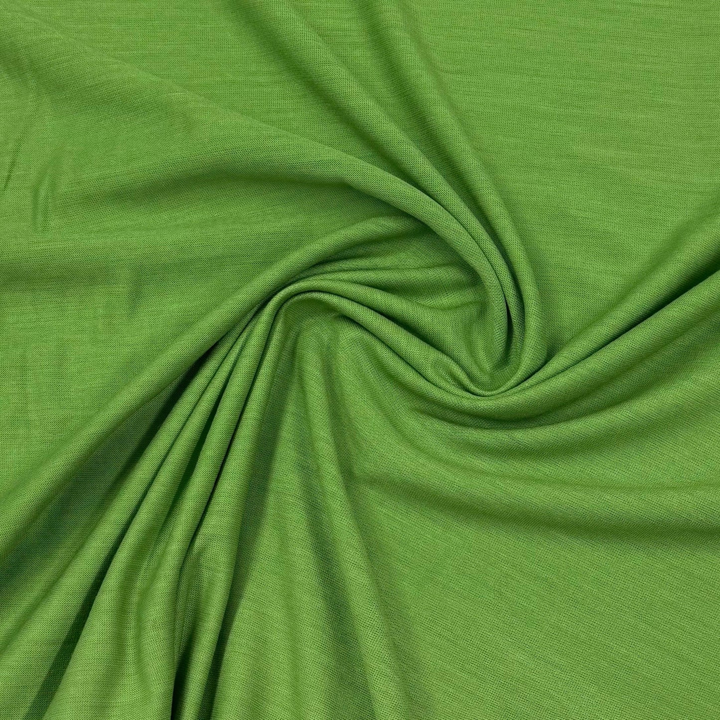 Vibrant green organic cotton fabric by Nature's Fabrics, soft texture and eco-friendly material