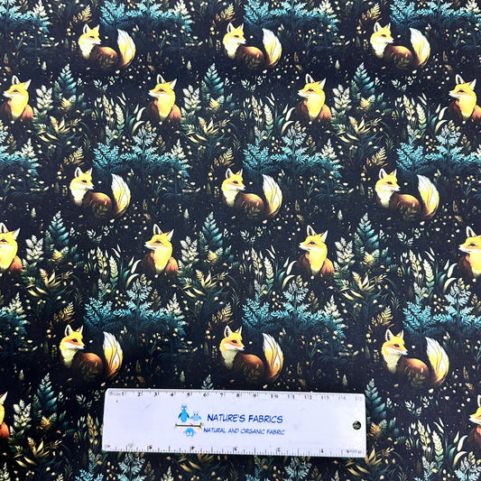 Nature's Fabrics organic fabric featuring a dark forest pattern with yellow foxes.
