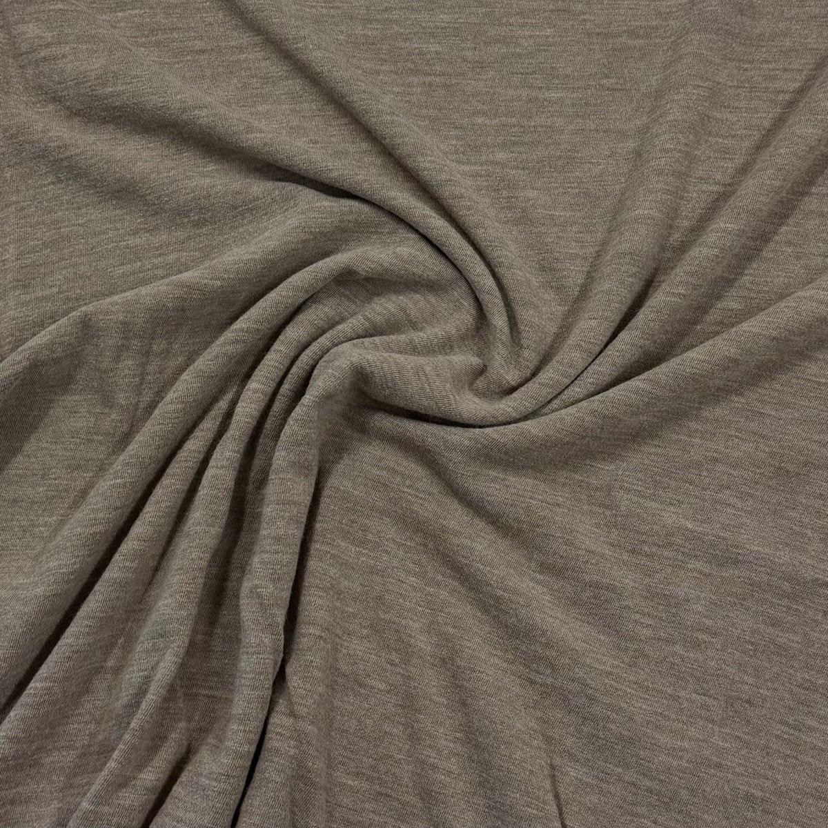 Soft heather gray organic cotton knit fabric by Nature's Fabrics, ideal for eco-friendly sewing projects