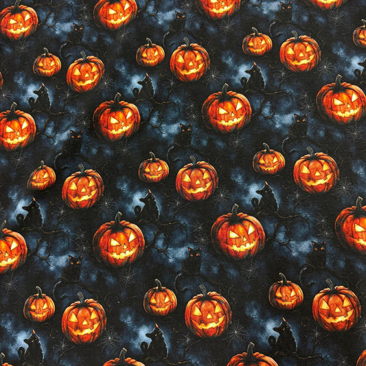 Halloween fabric with glowing jack-o'-lanterns, black cats, and spiderwebs by Nature's Fabrics