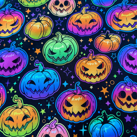 Vibrant Halloween pumpkin fabric with neon jack-o'-lanterns and stars, Nature's Fabrics