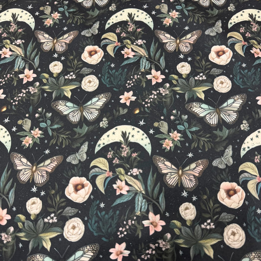 Nature's Fabrics floral butterfly print with moons and stars on dark background