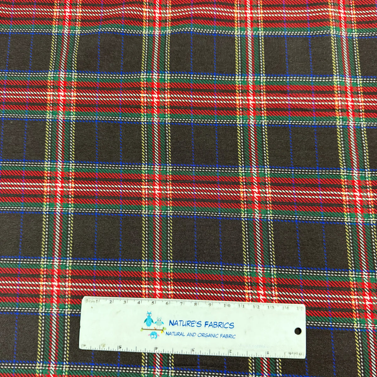 Nature's Fabrics plaid pattern with red, green, and black hues, showcasing natural organic fabric by the yard