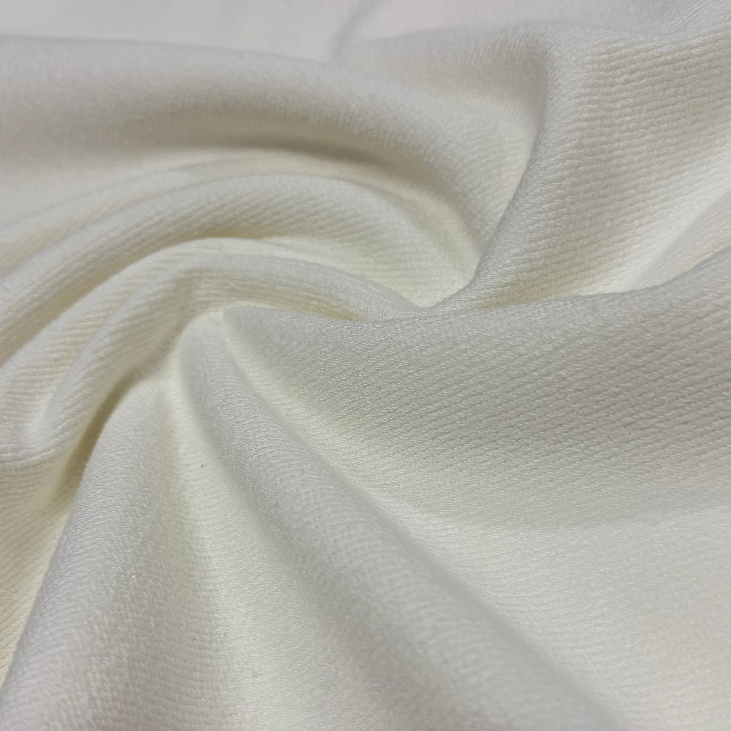 Soft white organic cotton fabric by Nature's Fabrics, ideal for eco-friendly sewing projects