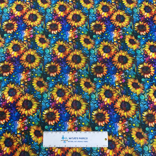 Nature's Fabrics colorful sunflower pattern organic fabric with a measuring ruler