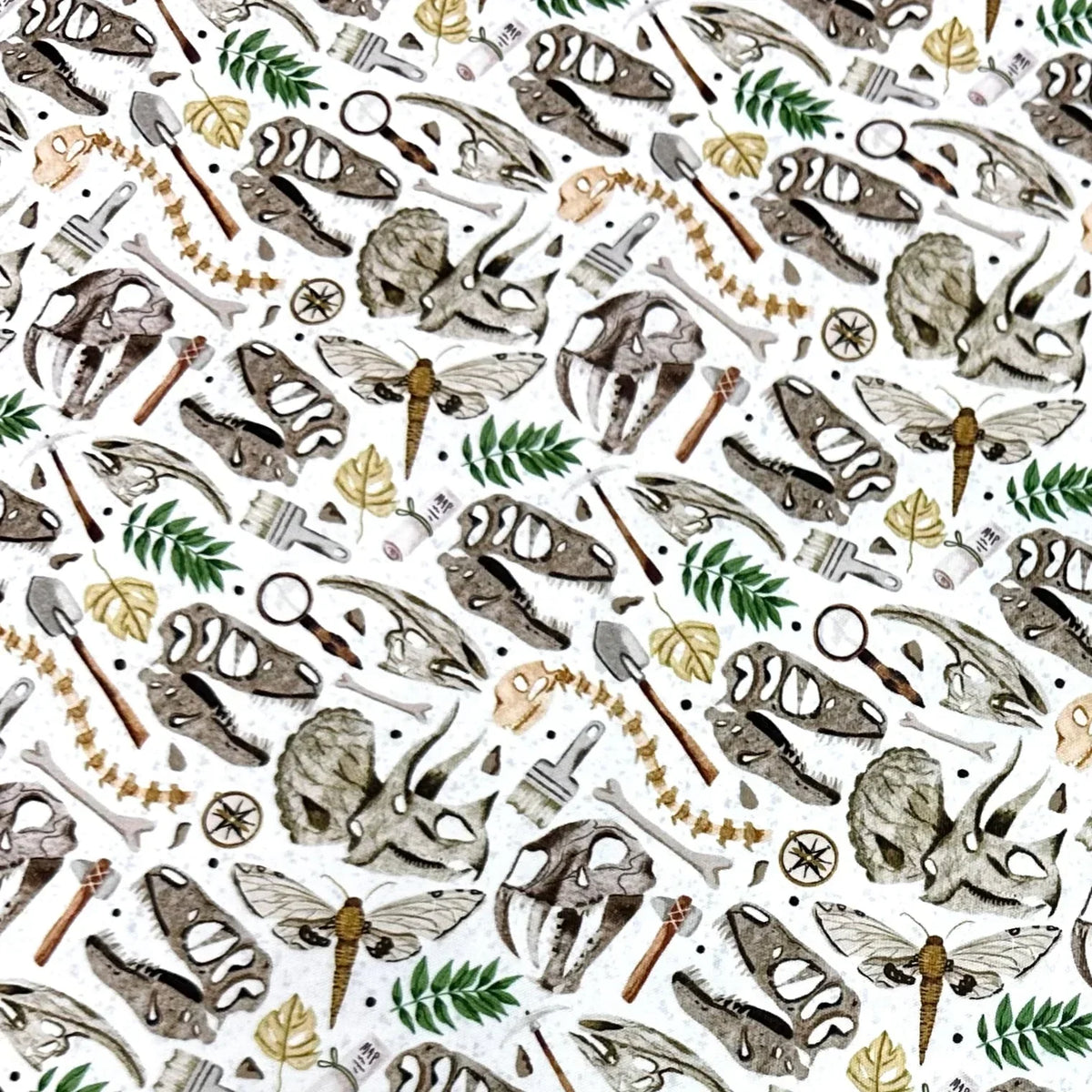 Dinosaur skull, leaf, and moth print fabric by Nature's Fabrics — organic cotton, eco-friendly design