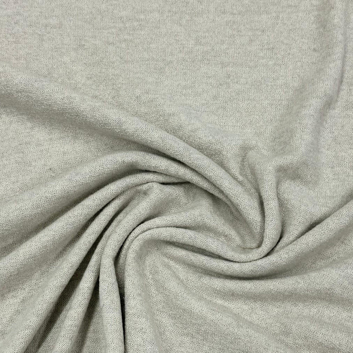 Close-up of draped light grey natural fabric from Nature's Fabrics