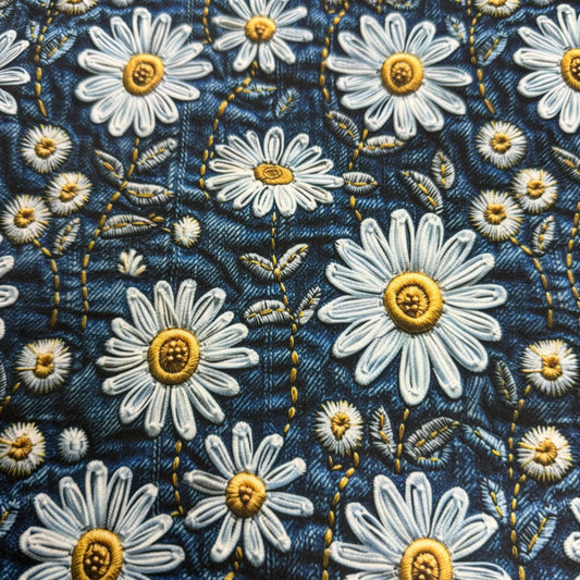 Nature's Fabrics blue denim textile with embroidered white daisies