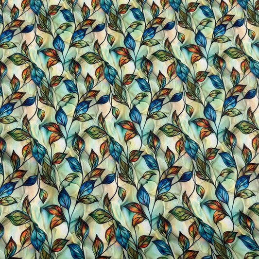 Nature's Fabrics organic cotton fabric with colorful blue, orange, and green leaf print
