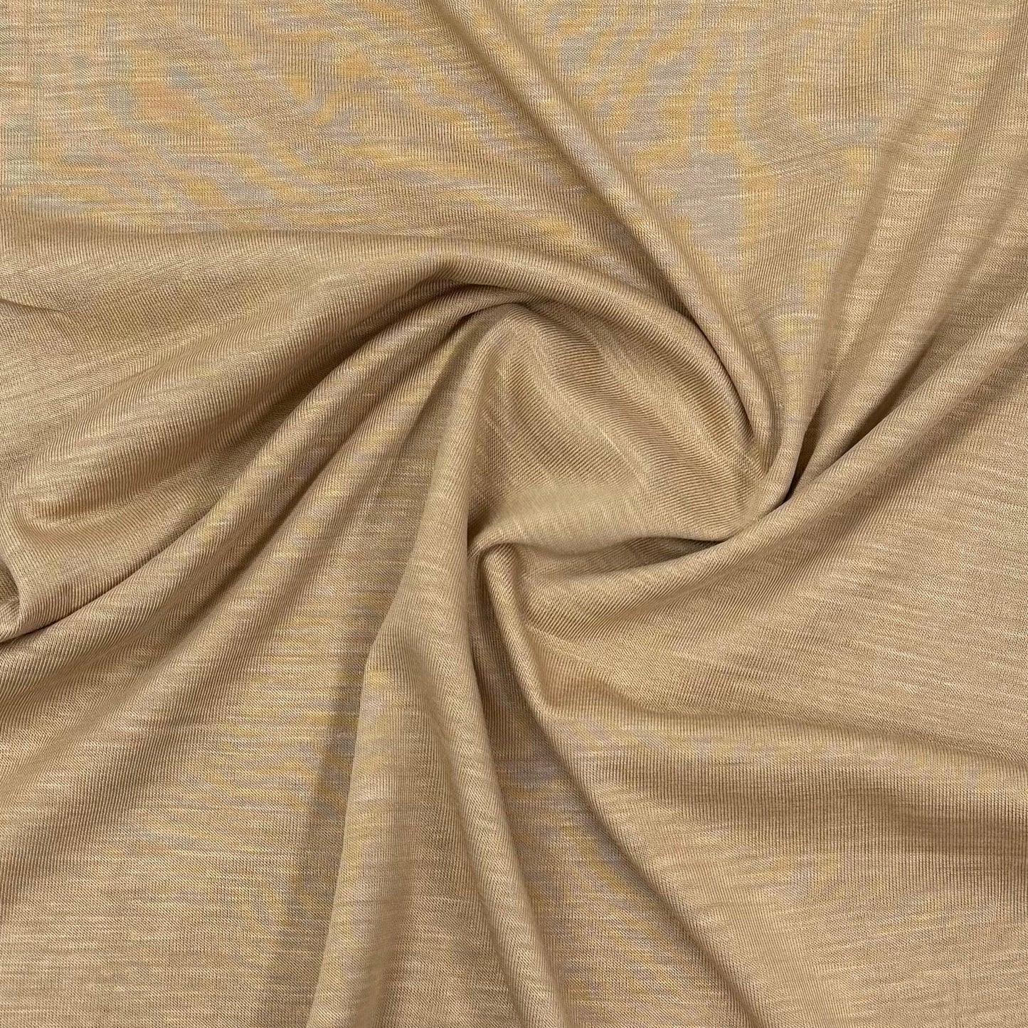 Nature's Fabrics organic cotton knit fabric in warm beige with subtle texture and soft drape