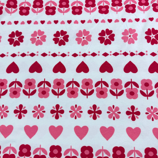 Nature's Fabrics red and pink floral and heart patterned cotton fabric