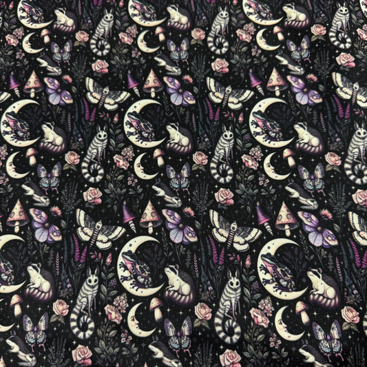 Nature's Fabrics celestial gothic print fabric with moons, moths, and forest animals