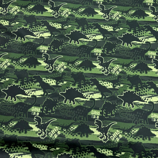 Nature's Fabrics green dinosaur print organic cotton fabric with DinoSaur text