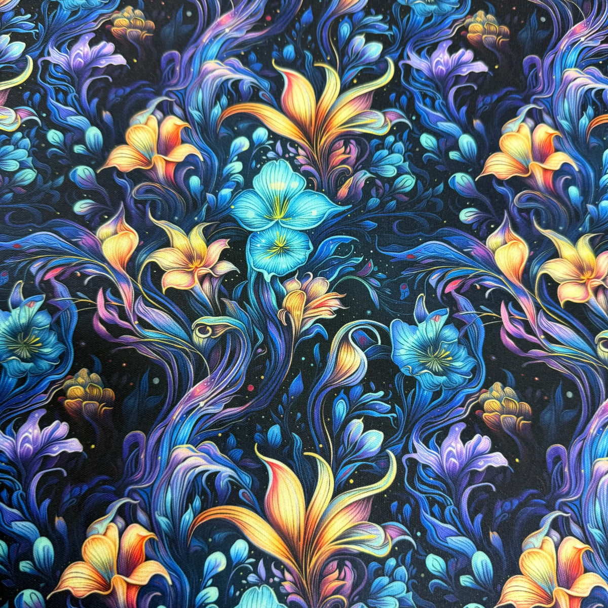 Vibrant floral fabric pattern with blue, orange, and purple blooms by Nature's Fabrics