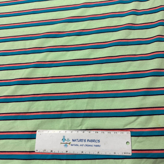 Nature's Fabrics mint green striped organic cotton fabric with ruler for scale, eco-friendly natural textile