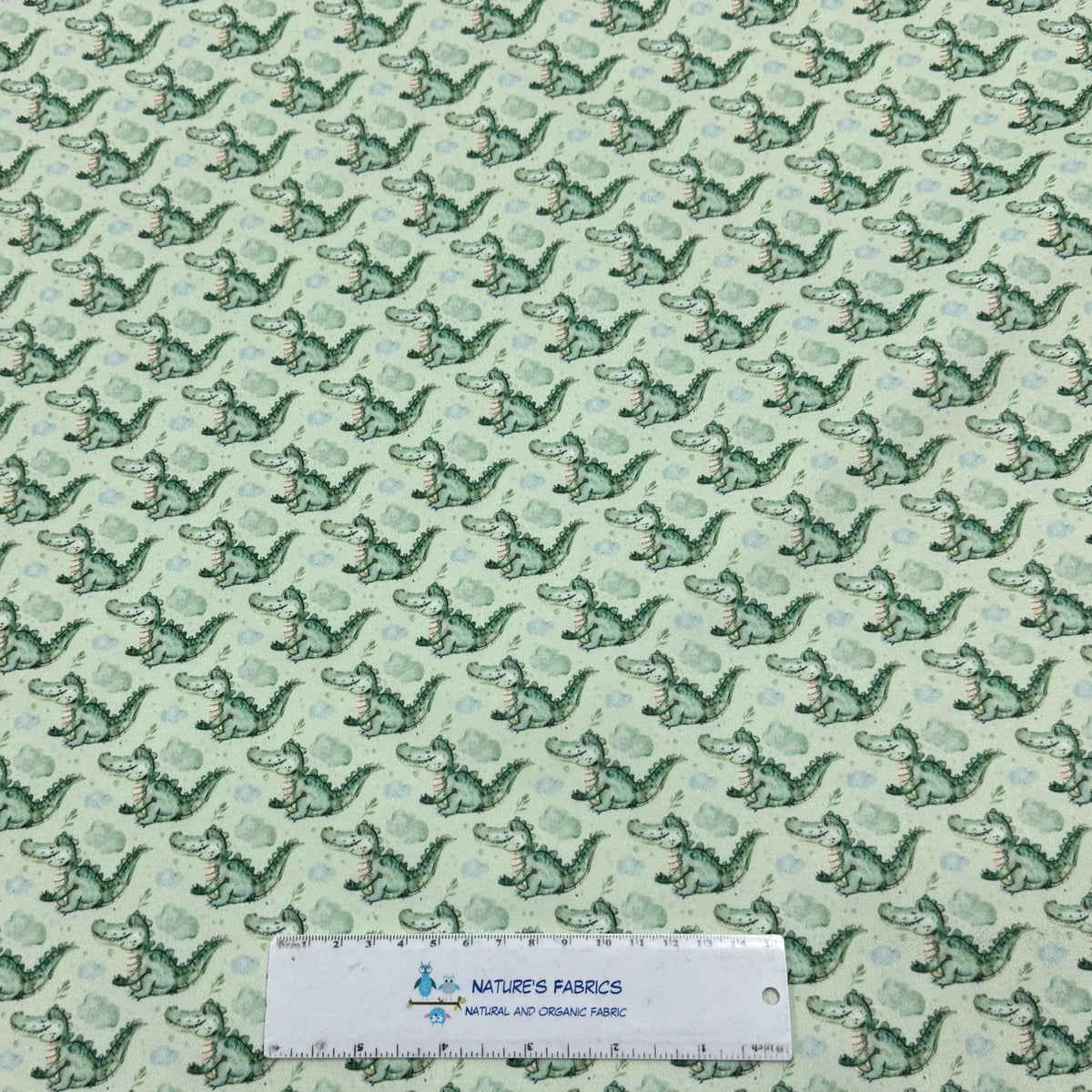 Cute green alligator print fabric by Nature's Fabrics, natural organic cotton for kids' crafts and sewing projects
