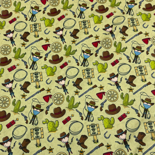 Nature's Fabrics yellow cotton fabric with wild west cowboy and cactus pattern