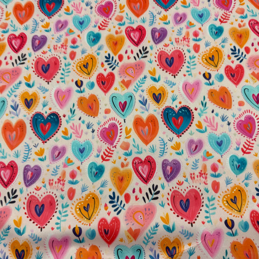 Nature's Fabrics multicolored heart pattern organic cotton fabric.
