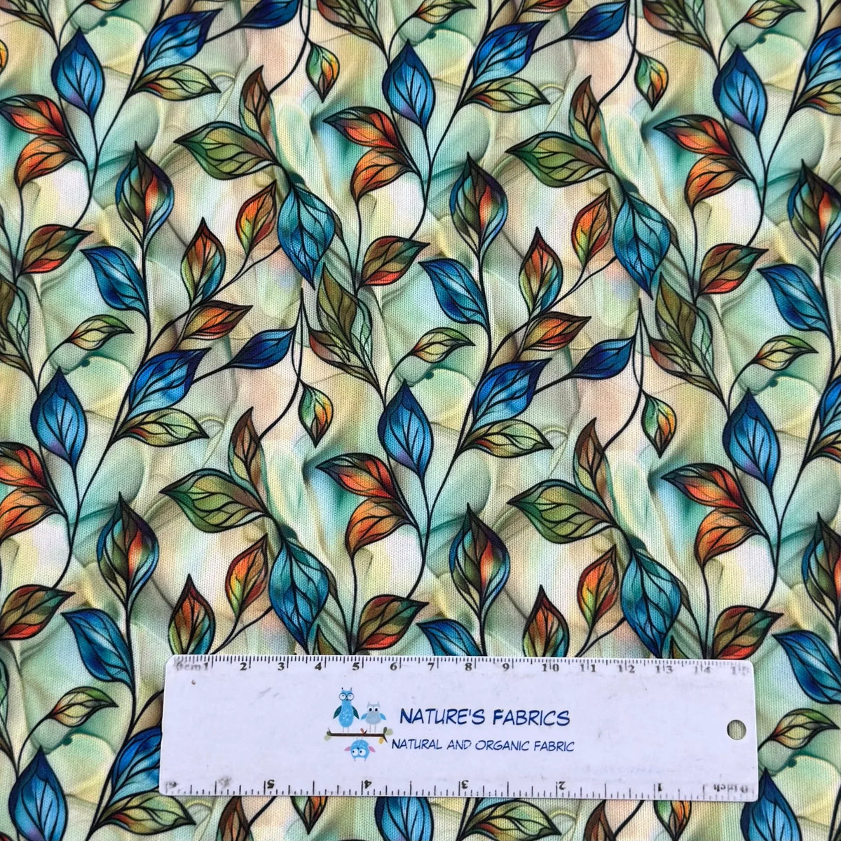 Nature's Fabrics organic cotton fabric with colorful leaf pattern, eco-friendly and natural