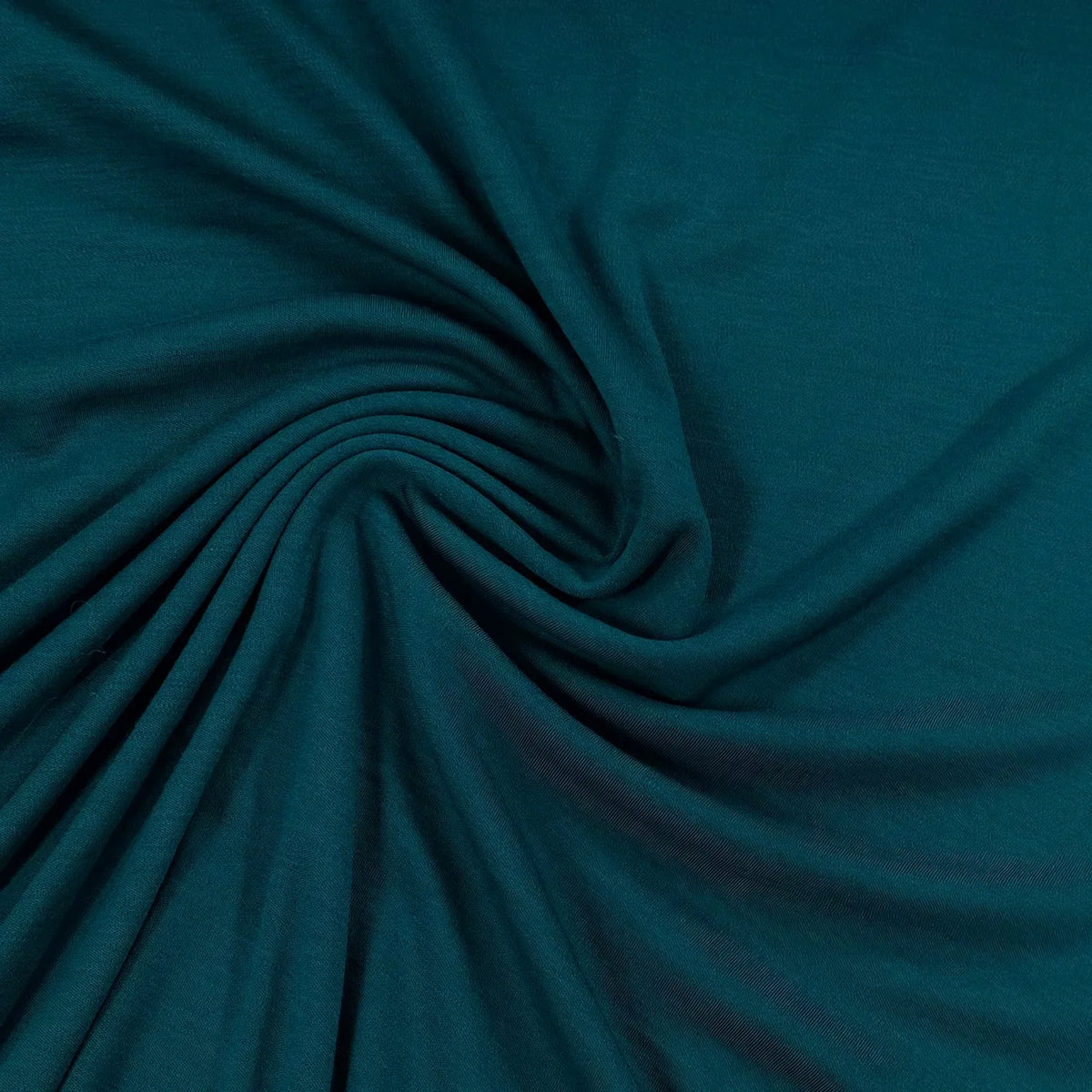 Deep teal organic cotton fabric swirled in soft folds, Nature's Fabrics
