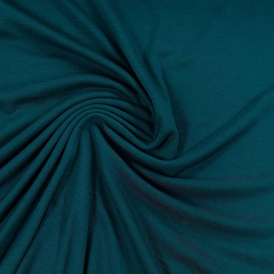 Deep teal organic cotton fabric swirled in soft folds, Nature's Fabrics
