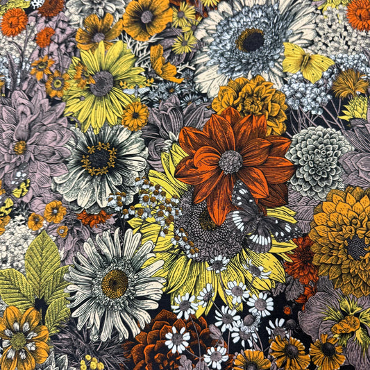 Vibrant floral print fabric with sunflowers, daisies, and butterflies by Nature's Fabrics
