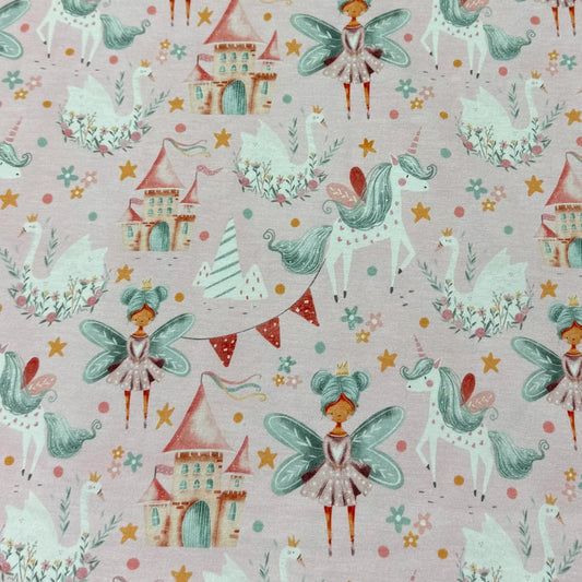 Nature's Fabrics pink cotton fabric with whimsical fairies, unicorns, and castles pattern.