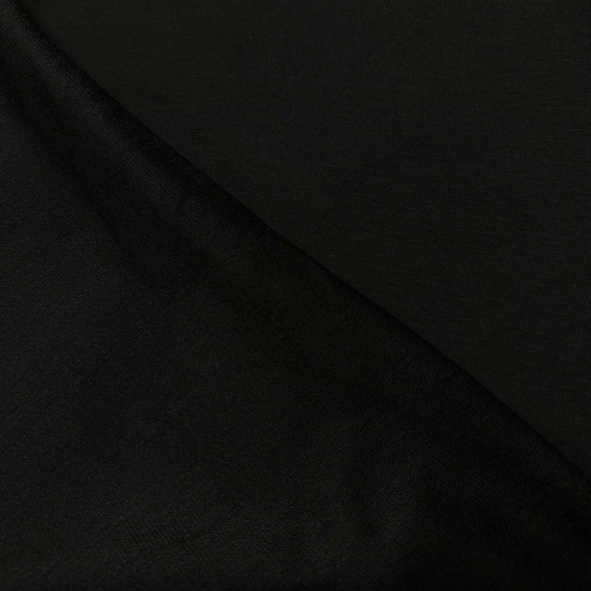 Black organic cotton fabric by Nature's Fabrics, premium natural textile for sewing and crafts