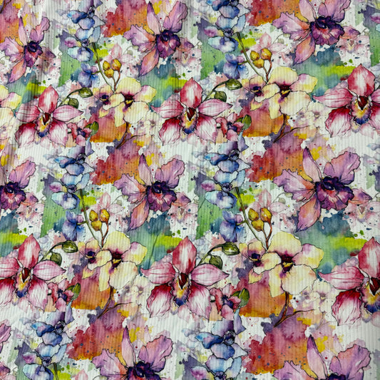 Nature's Fabrics watercolor orchid floral print fabric in pink, purple, and yellow.