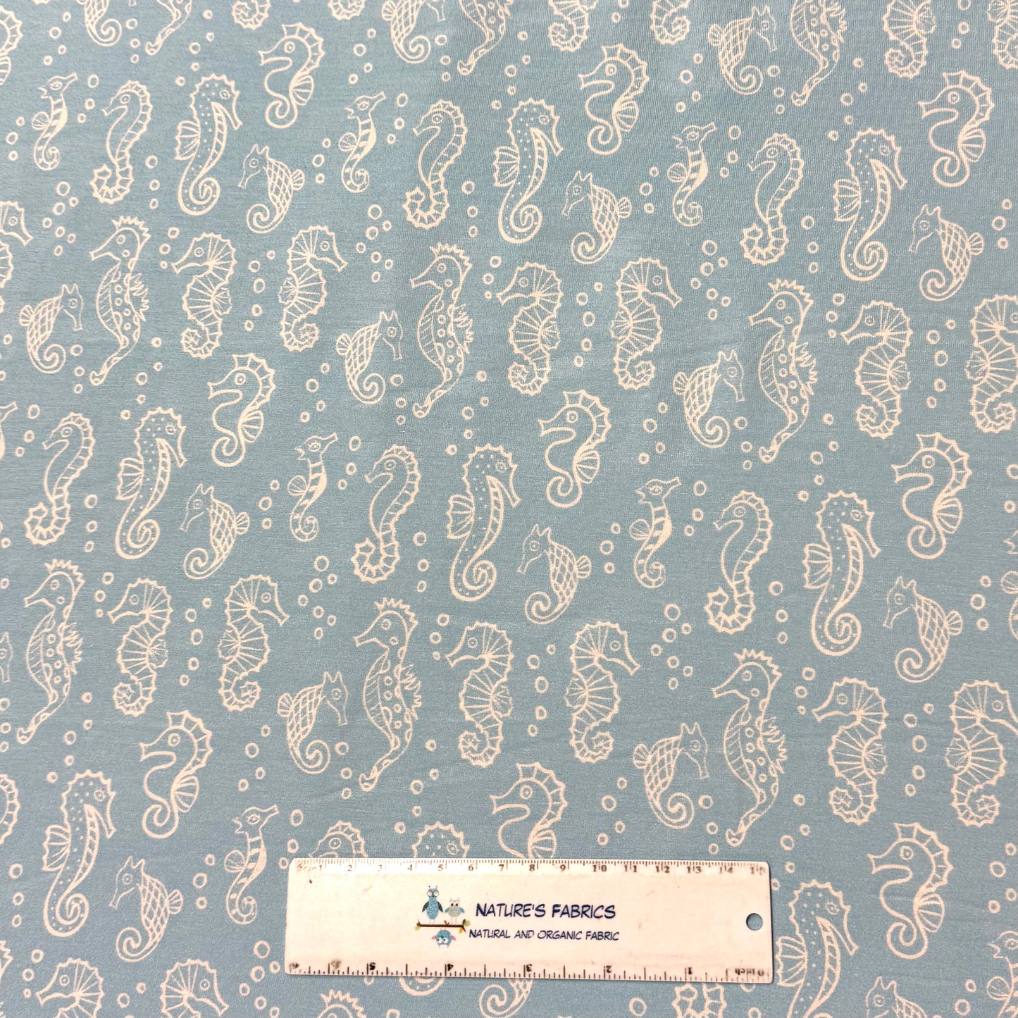 Seahorses on Blue Bamboo/Spandex Jersey Fabric - 200GSM