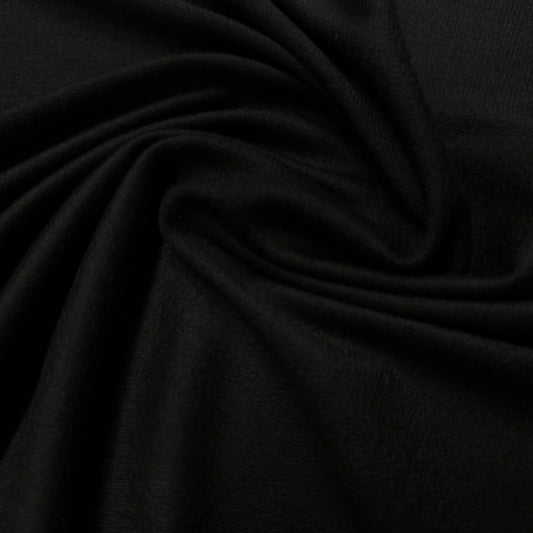 Black organic cotton fabric by Nature's Fabrics, soft texture and natural drape for eco-friendly sewing projects.