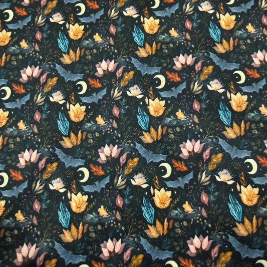 Nature's Fabrics floral pattern with moon and leaves on dark background