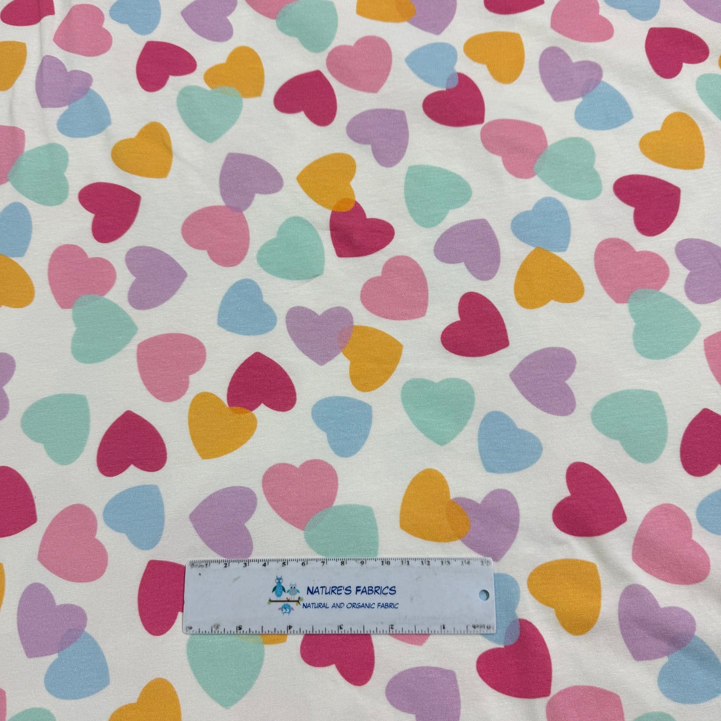 Pastel Heart Toss on Off White Bamboo/Spandex Jersey Fabric - Printed in the USA