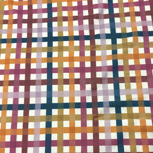 Nature's Fabrics multi-colored plaid woven fabric with orange, purple, and blue stripes.