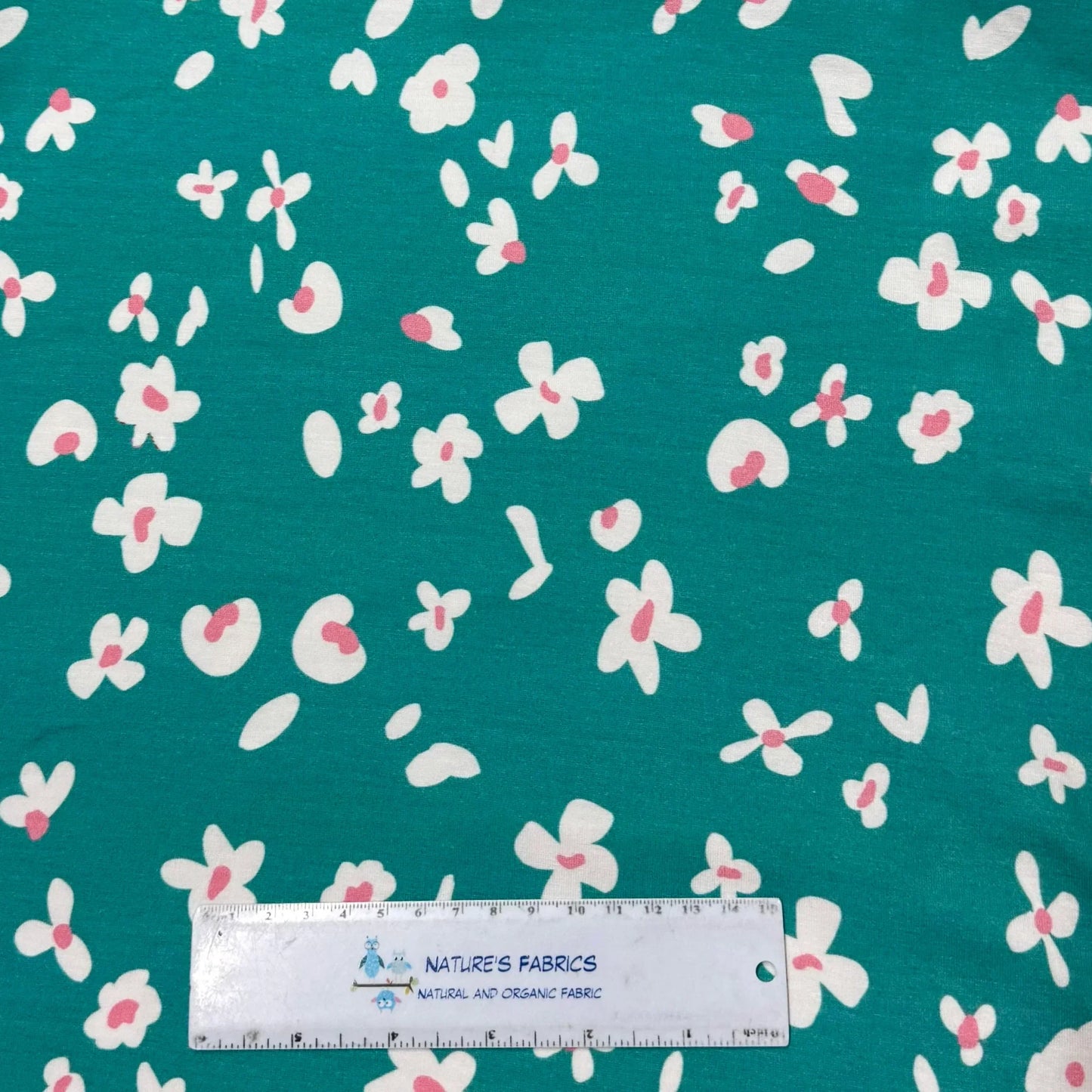 Teal fabric with white and pink floral print by Nature's Fabrics, natural organic cotton