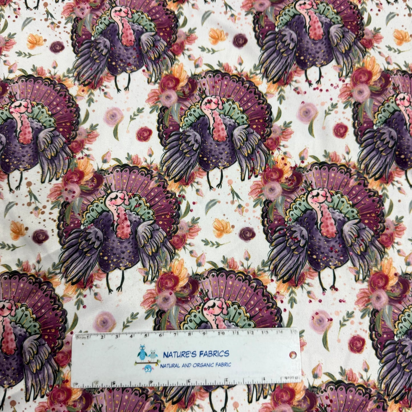 Purple turkey print fabric with floral background by Nature's Fabrics, organic cotton yardage
