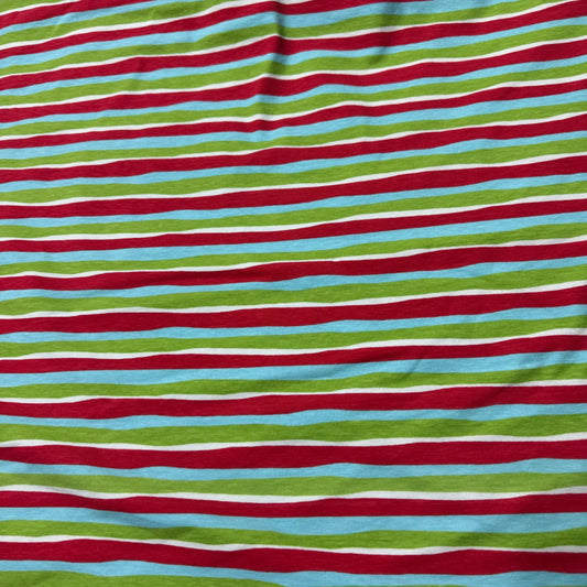 Nature's Fabrics red, green, blue, and white horizontal striped natural fabric.