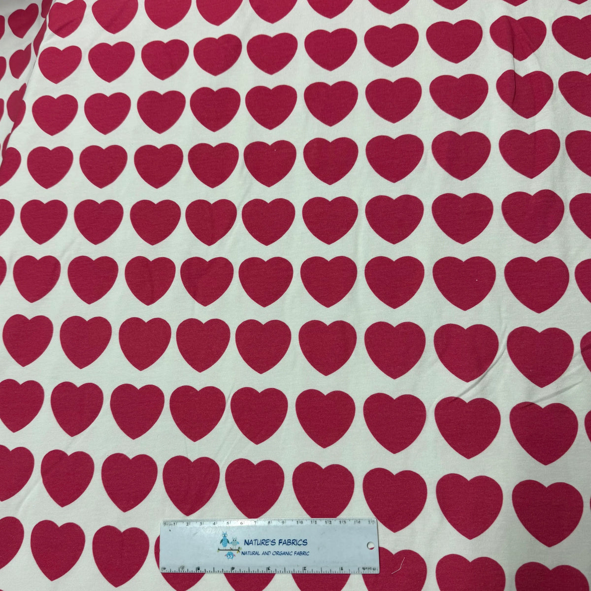 Red heart pattern organic cotton fabric by Nature's Fabrics, natural and eco-friendly textile