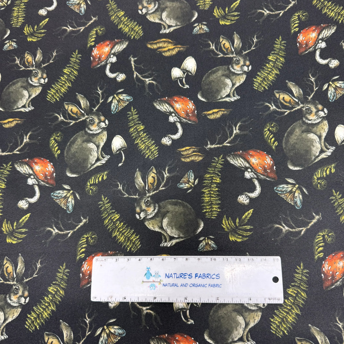 Nature's Fabrics organic cotton fabric with woodland rabbits, mushrooms, and ferns pattern