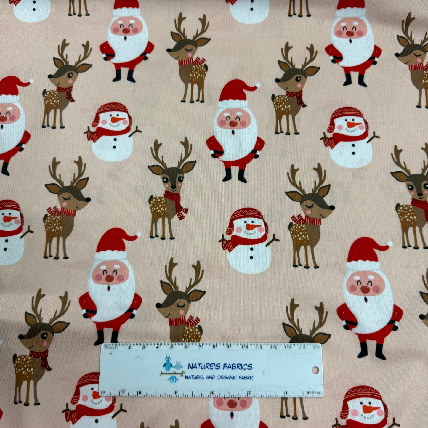 Santa and Reindeer on Peach 1 mil PUL Fabric - Made in China- Seconds