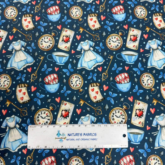 Alice in Wonderland fabric with clocks, teacups, hearts, and dresses by Nature's Fabrics