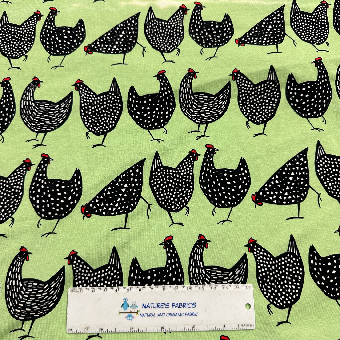 Black Chickens on Green Organic Cotton/Spandex Jersey Fabric