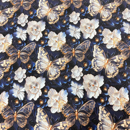 Nature's Fabrics butterfly and floral print fabric with gold accents on dark blue background