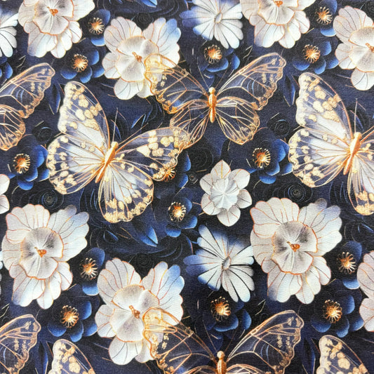 Nature's Fabrics dark blue textile with gold butterflies and white floral patterns