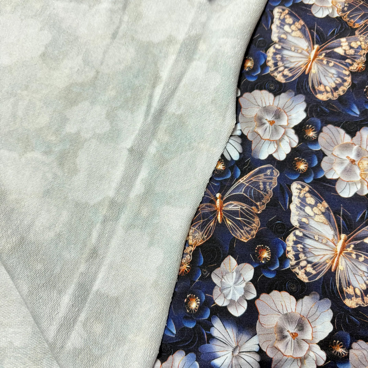 Nature's Fabrics: butterfly and floral print on dark blue fabric beside light green tie-dye textile