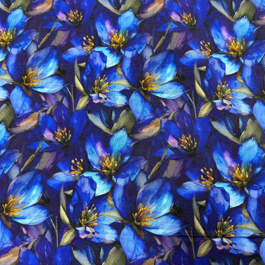 Nature's Fabrics blue floral print fabric with detailed blue blossoms and yellow centers