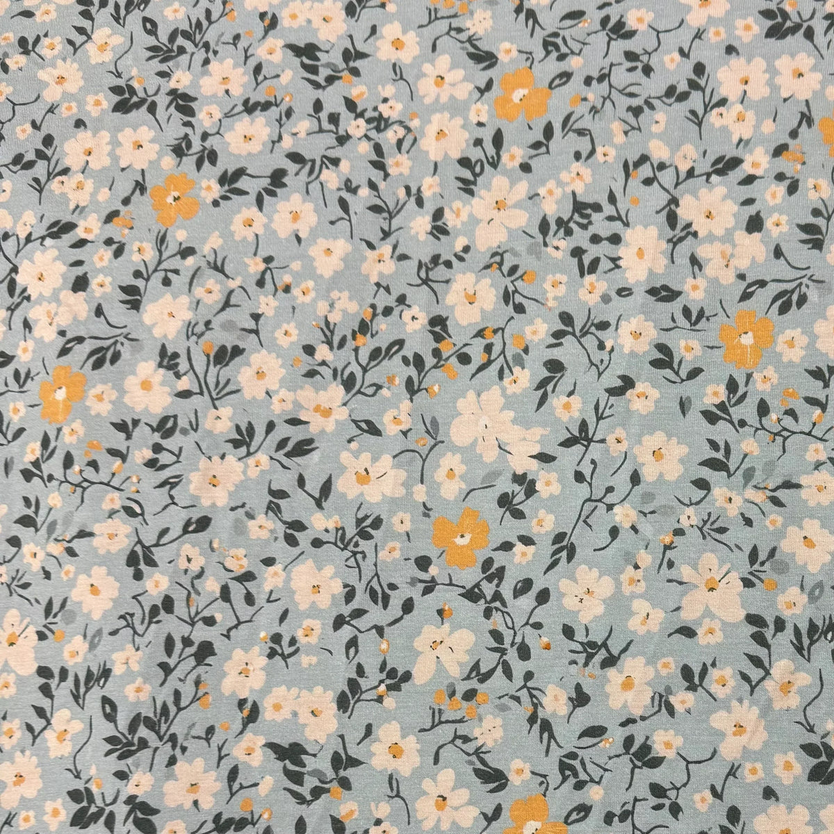 Nature's Fabrics blue floral print natural fabric with white and yellow blossoms